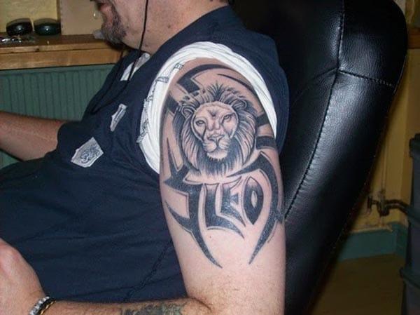 The Leo Tattoo on the left upper arm with dark ink design makes a man look majestic 
