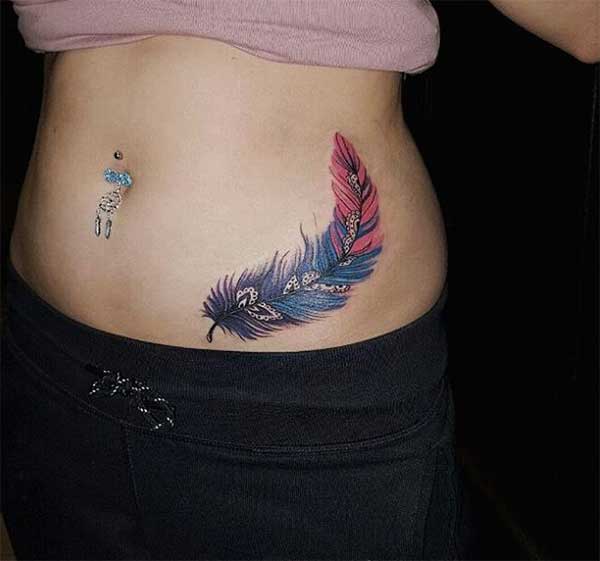 Blue feather tattoo design idea on side of stomach