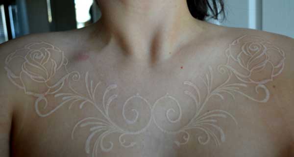 feminine white tattoos