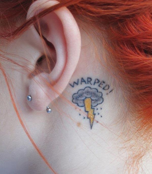 Cloud Tattoo behind the ear brings the feminist look