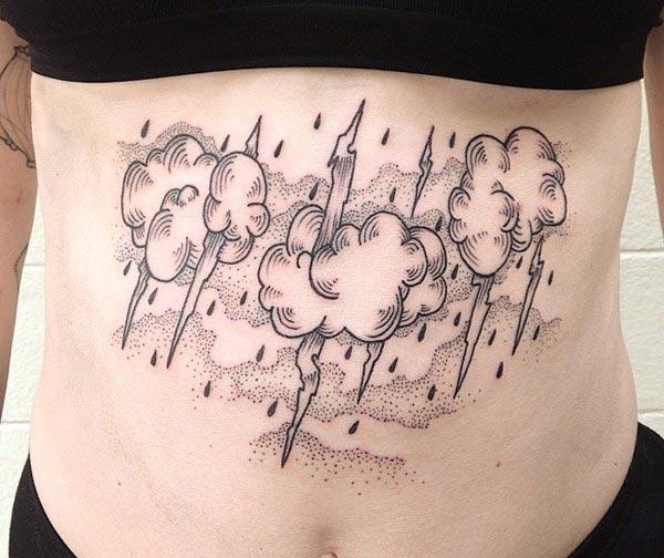Cloud Tattoo on the belly makes a girl look captivating 