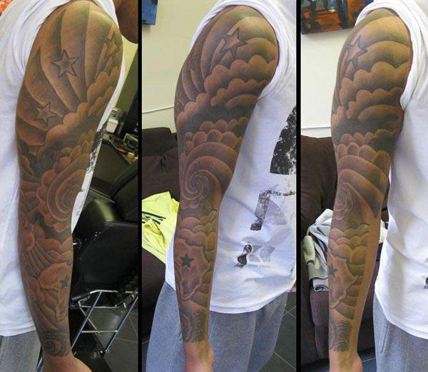 Cloud Tattoo on the arm makes a man look cool