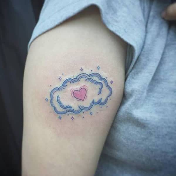 Cloud Tattoo on the arm makes a woman look captivating
