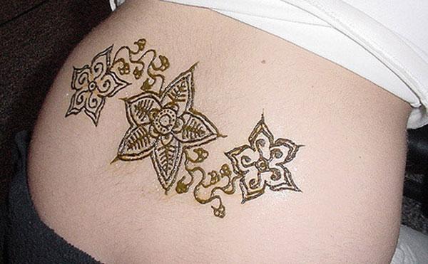 Lower back Mehndi tattoo designs idea