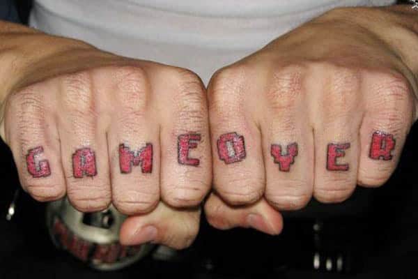 Knuckle Tattoo for men with a pink ink design make them look elegant