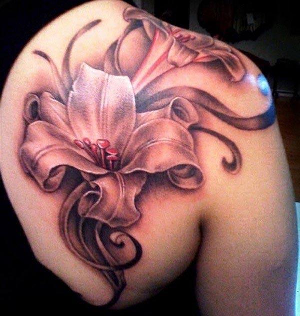The Lily tattoo on the back shoulder makes a girl have magnificent look