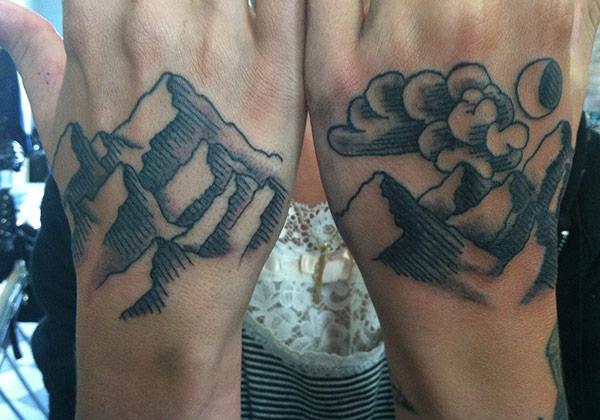 Mountain Tattoo on the back of the hand makes a man look magnificant
