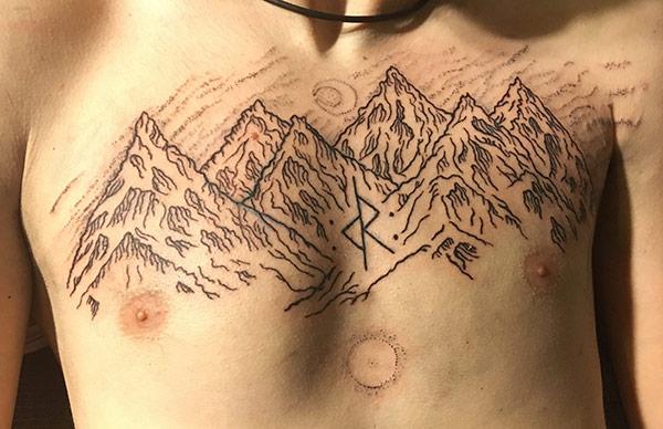 Mountain Tattoo on the chest makes a man look cute