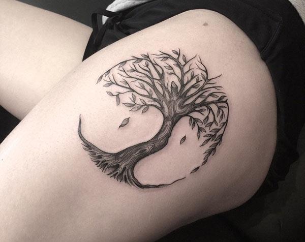 The Tree of Life tattoo on the left side thigh, brings the loyalty look in girls