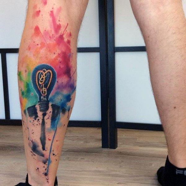 Watercolor tattoo on the foot makes a man look ostentatious 