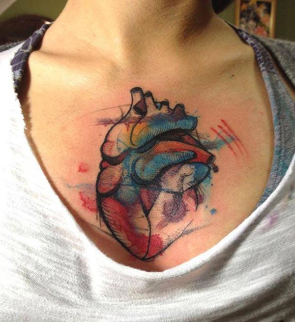 Watercolor tattoo on the upper chest brings a feminist look
