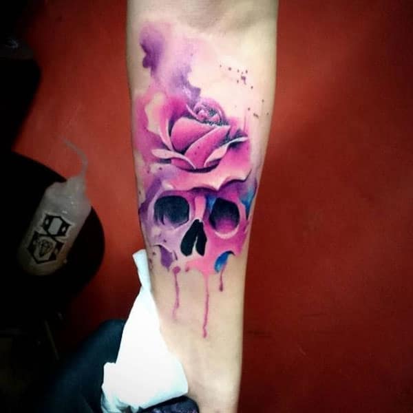 Watercolor tattoo on the lower arm brings the captivating look