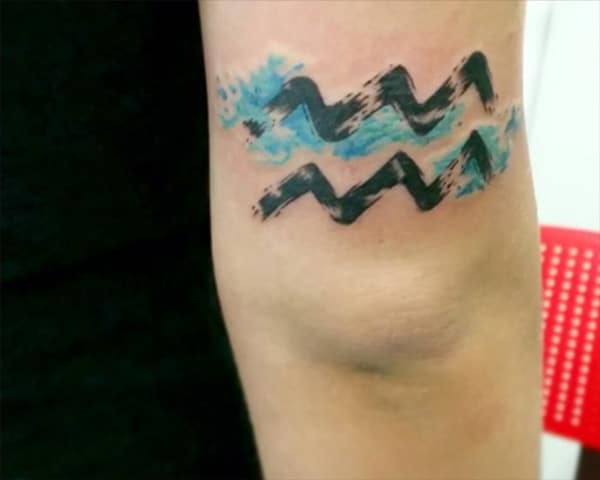 Stylish design of Aquarius tattoo to match your dressing sense