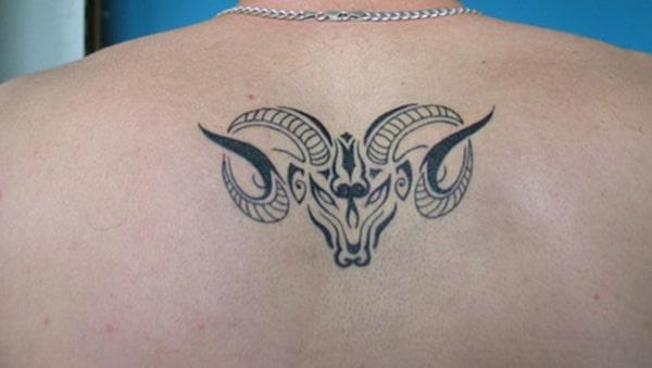 Upper back Aries tattoo design idea for men