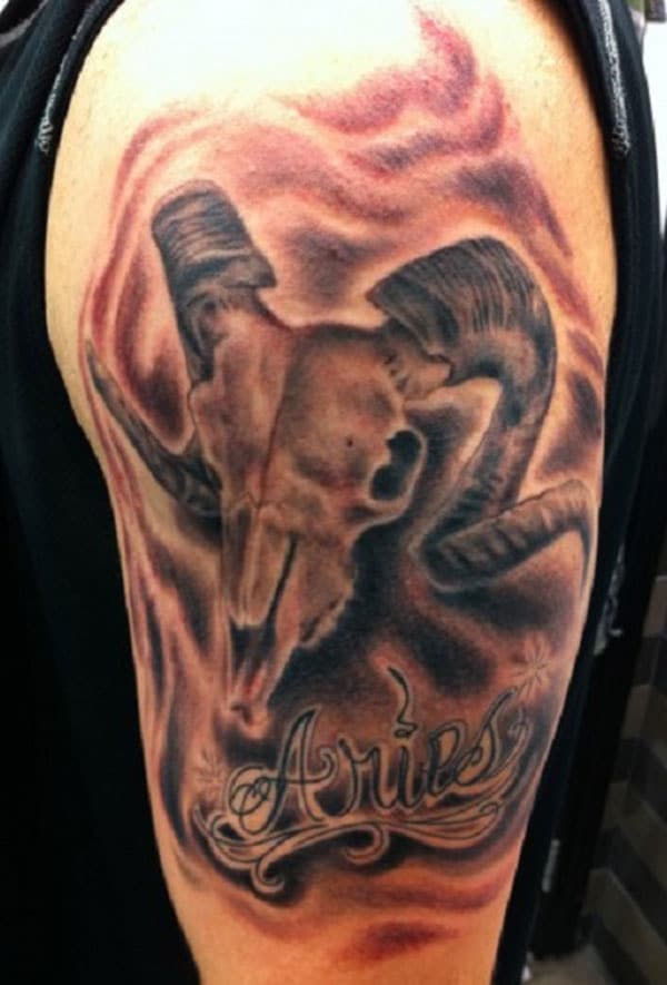 Unique Aries tattoo idea on upper arm of the boy