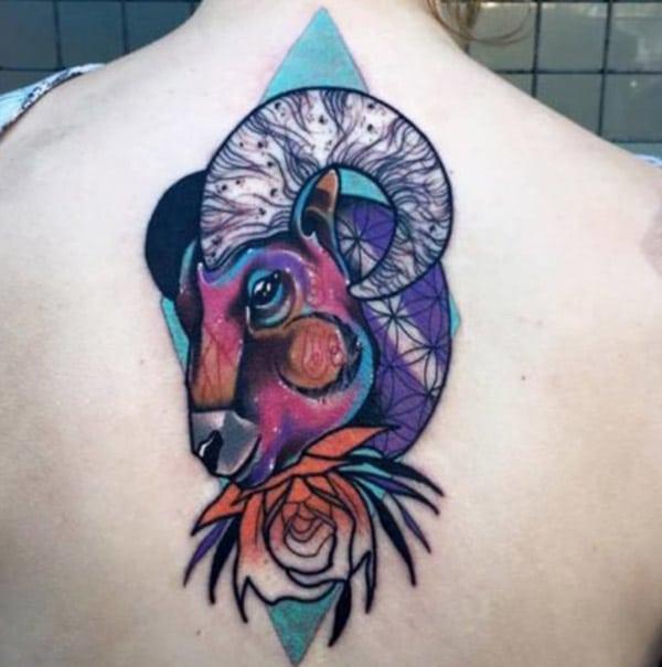 Colorful Aries sign tattoo design idea on back of the girl