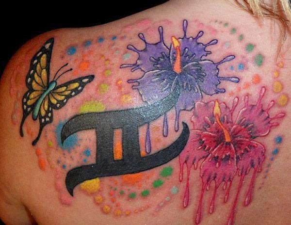 Awesome Gemini tattoo idea on the upper back of female