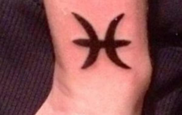 The small Gemini design tattoo idea on the lower hand for a boy