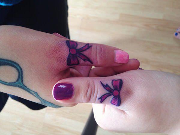 Bow tattoo around your finger brings about the memory or makes it as a reminder