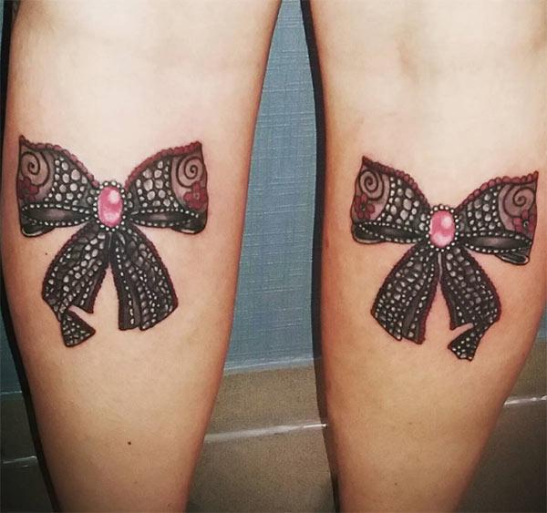 Bow tattoo on the backof the legs makes ladies look lovely