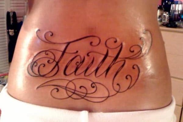 flaunt lower back region with the bold and sexy Faith tattoo