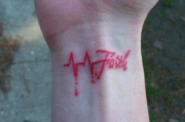 Heartbeat Faith tattoo on a girl’s hand is a symbol of love