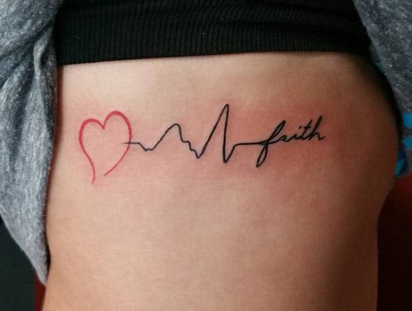 Heartbeat Tattoo on the upper arm make a girl look adorable