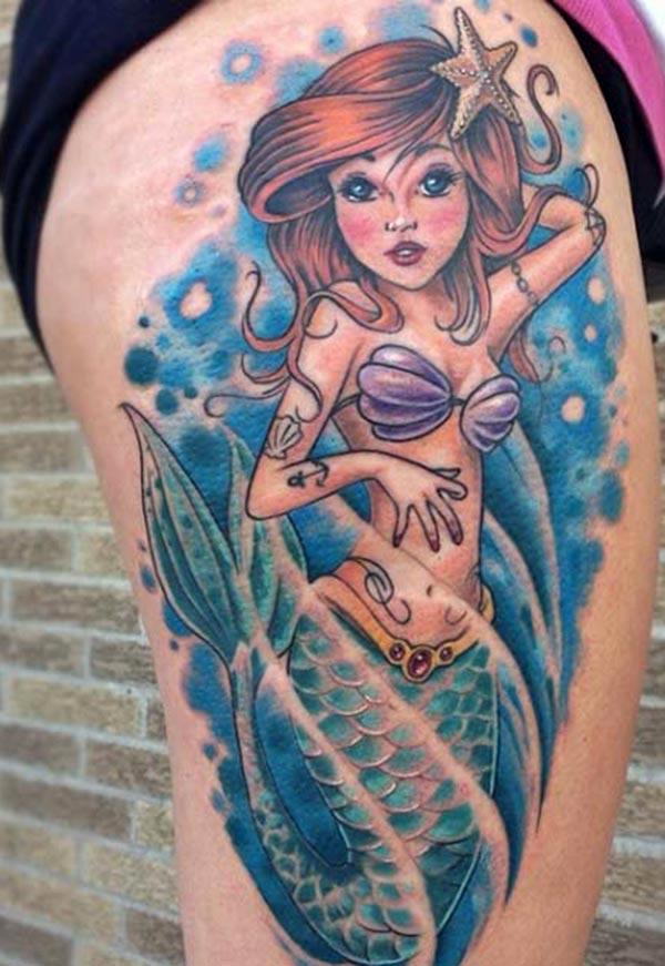 The mermaid tattoo designed for the upper thighs of the girl 