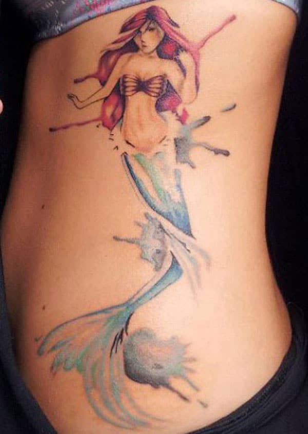 The famous fairy tale tattoo design on the side view of back for the girl