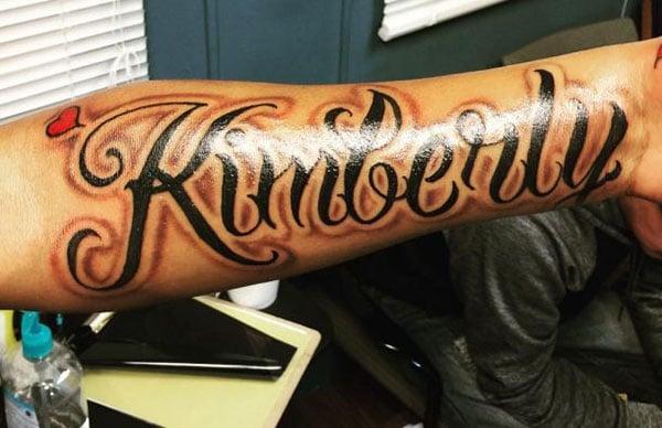 Name Tattoo on the lower arm brings the flashy look