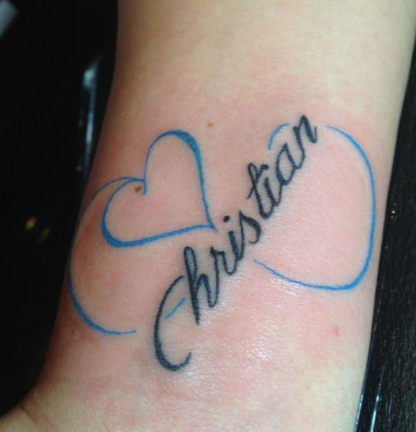 Name Tattoo with blue love ink design drawing makes a girl look attractive