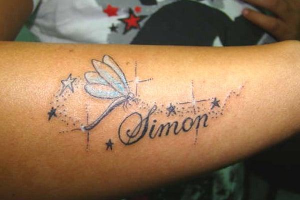 Name Tattoo on the lower arm brings the charming look
