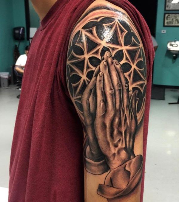 Praying Hand Tattoo on the shoulder brings the gentle look