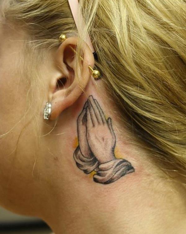 Praying Hand Tattoo behind the ear makes a women look attractive