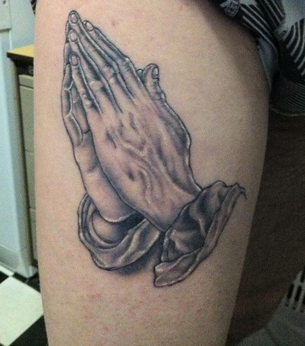 Praying Hand Tattoo on the side thigh brings a sexy look