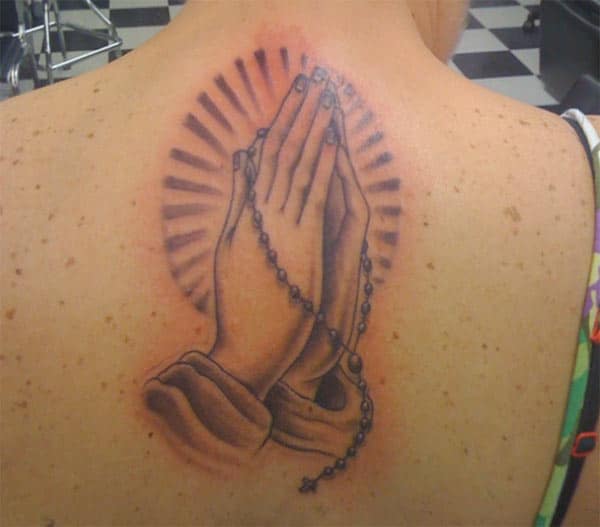Praying Hand Tattoo on the back brings the astonishing 