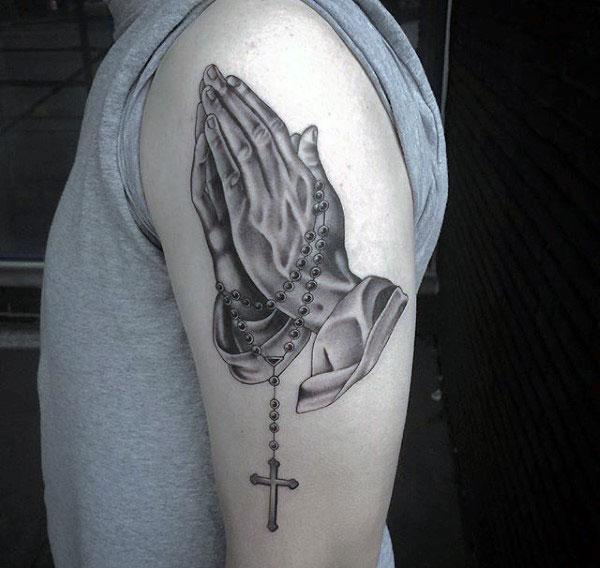 Praying Hand Tattoo on the shoulder brings the august look