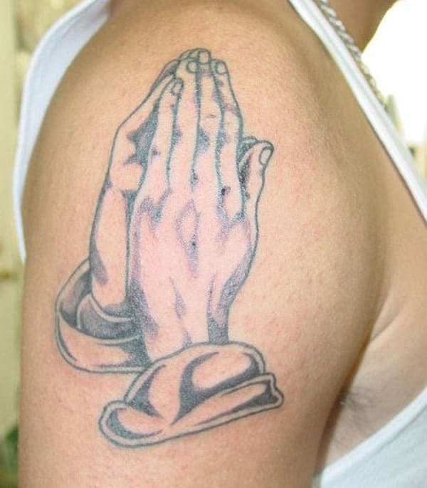 Praying Hand Tattoo on the shoulder brings the elegant look