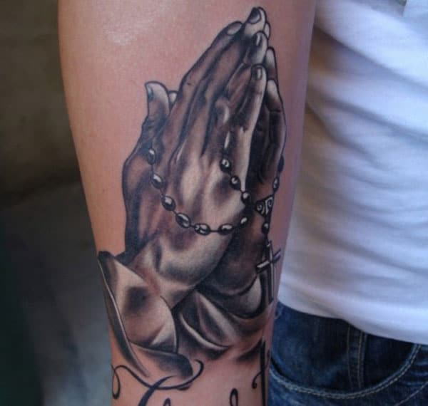 Praying Hand Tattoo on the upper arm makes a man appear magnificent