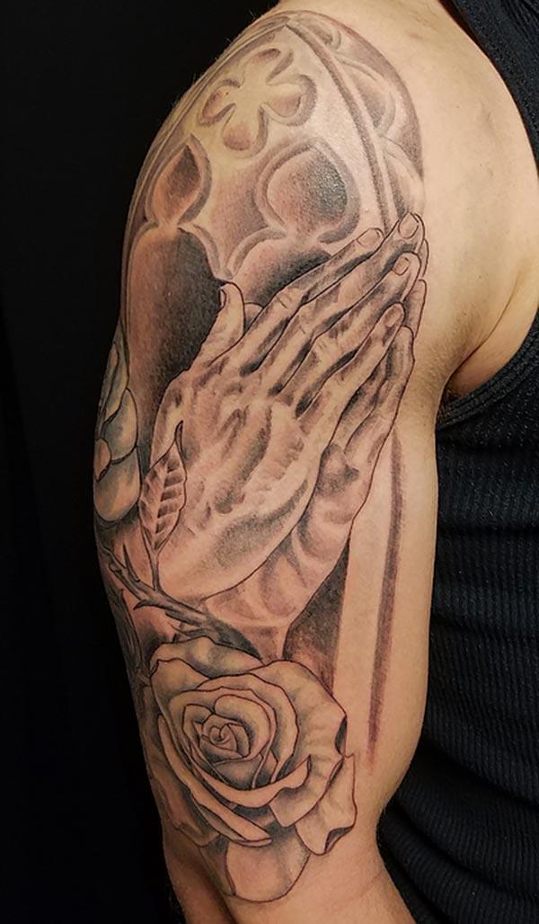 Cool praying hand tattoo design idea on shoulder for guys