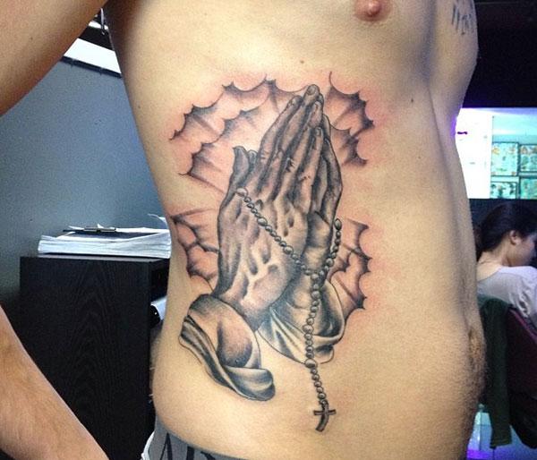 Praying Hand Tattoo on the side belly to make the look cute