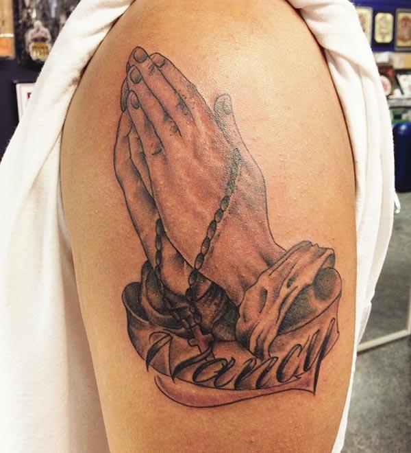 Praying Hand Tattoo on the shoulder makes a man look glamourous