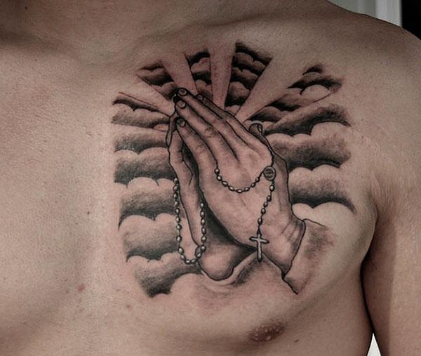 Praying Hand Tattoo on the upper chest makes a man look admirable