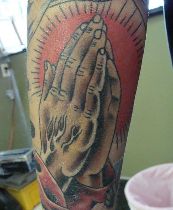 Praying Hand Tattoo on the foot brings the sharp and stylish look