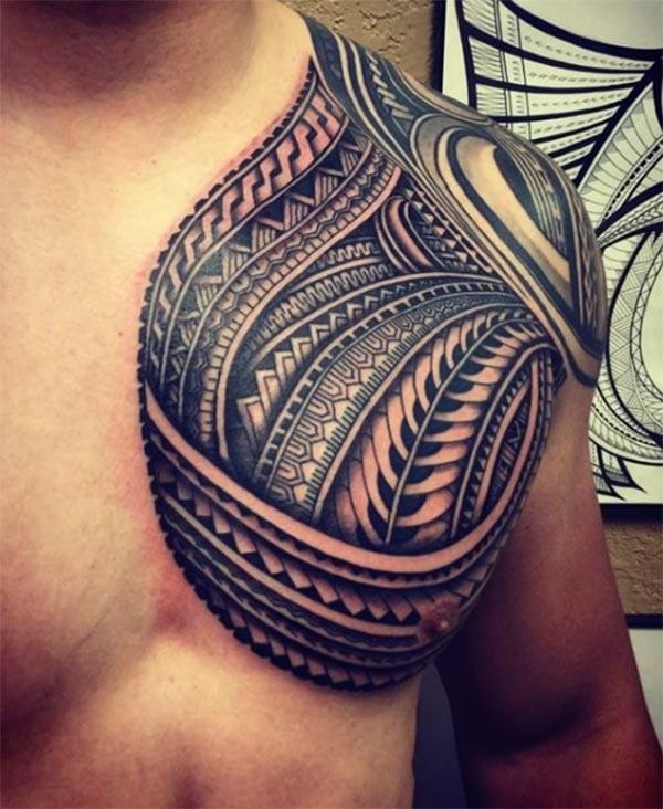 Samoan Tattoo on the chest overlapping to the arm makes a man look admirable