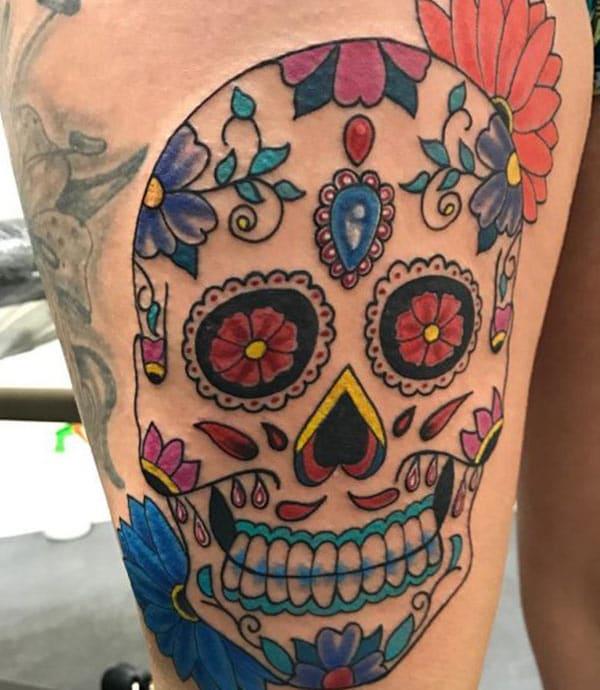 The best Red, Blue and green sugar skull tattoo on female leg