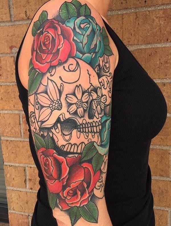 The Best sugar skull tattoo with full of flowers on girl’s arm