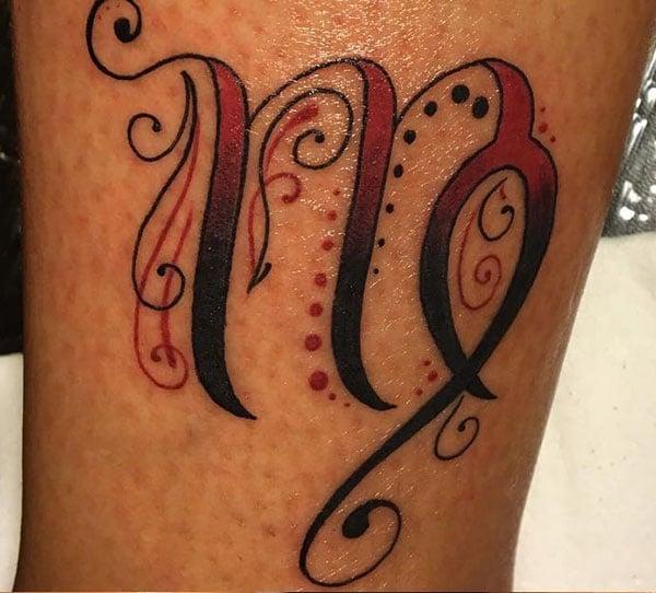 Virgo tattoo with a black and brown ink design makes a lady look captivating