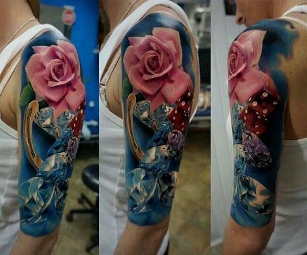 Amazing Tattoo with a blue and pink ink, flower design makes a man look elegant