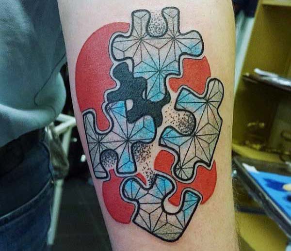 Autism Tattoo on the lower arm gives men ostentatious look